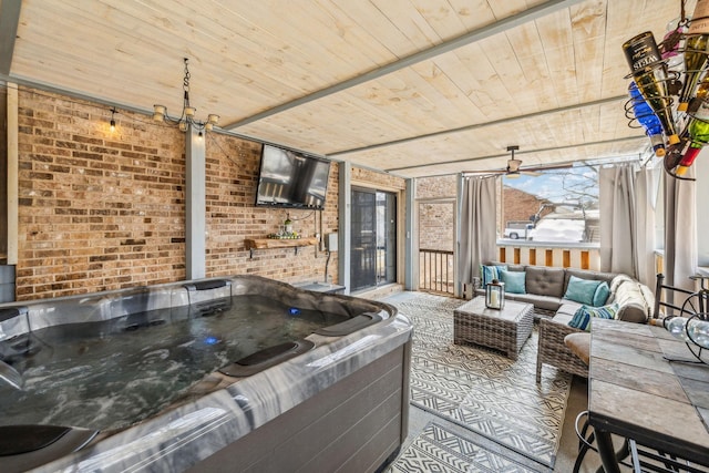 view of patio with an outdoor hangout area and a hot tub