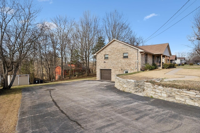 view of side of home with a garage