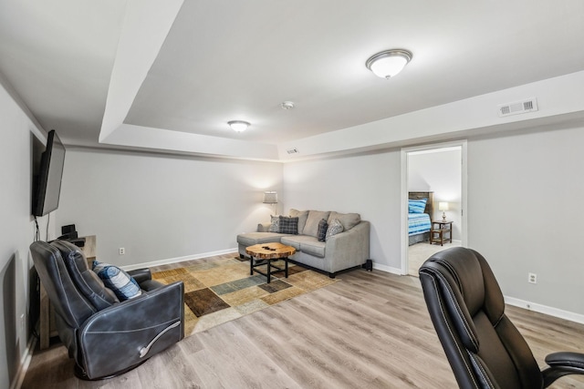 living room with light hardwood / wood-style flooring