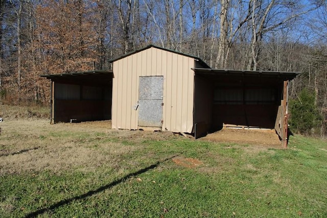 view of outbuilding featuring a yard