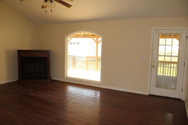 unfurnished living room with ceiling fan, dark hardwood / wood-style flooring, and vaulted ceiling