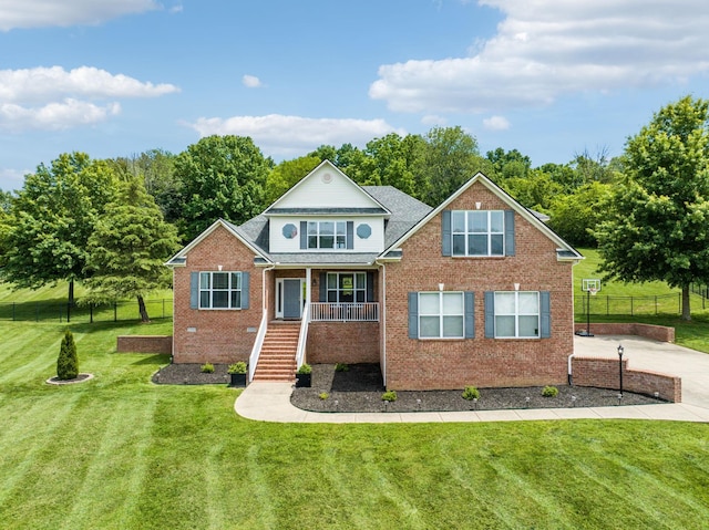 view of front of property with a front yard and a porch