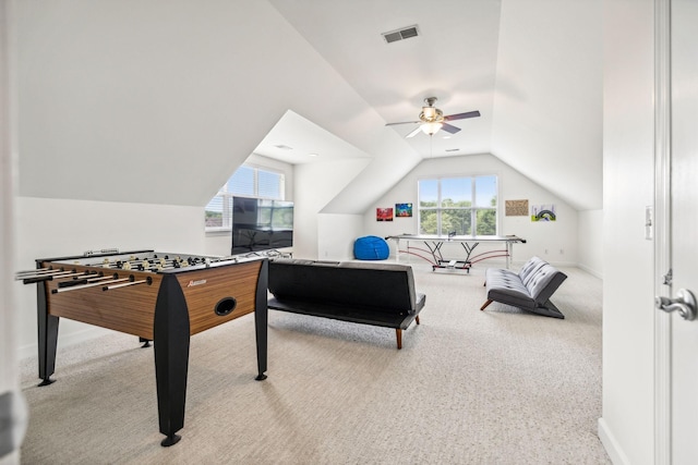 rec room featuring carpet floors, ceiling fan, and vaulted ceiling