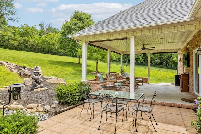 view of patio / terrace featuring a gazebo and ceiling fan