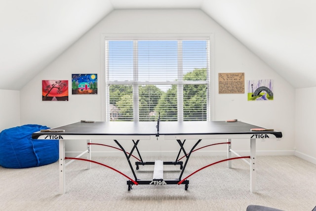 rec room with carpet floors and vaulted ceiling