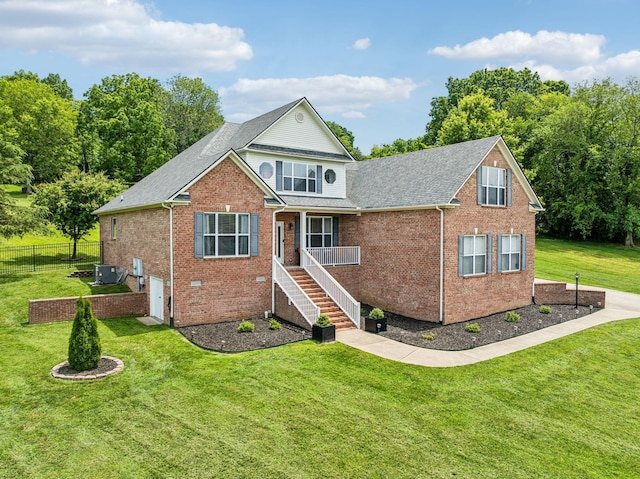 view of front of property with central air condition unit and a front lawn