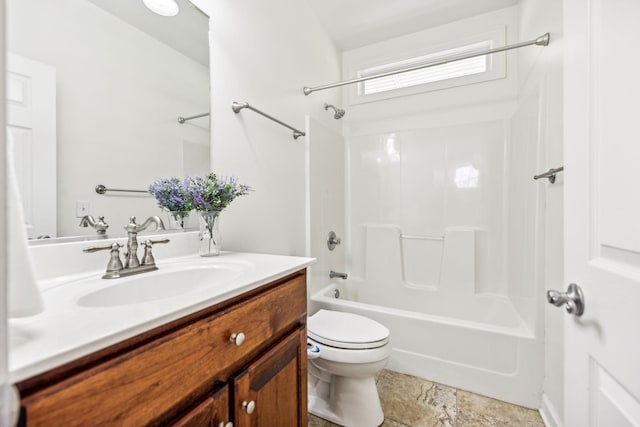 full bathroom featuring toilet, vanity, and washtub / shower combination