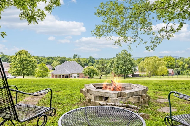 view of yard featuring a fire pit