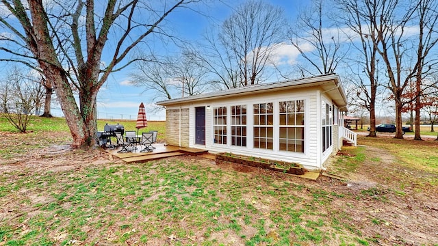 rear view of house featuring a deck