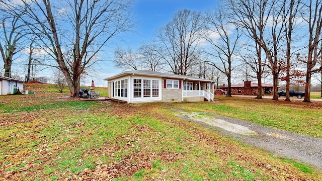 view of front of home featuring a front yard and a porch