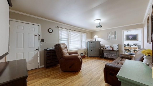 living room featuring light hardwood / wood-style floors and ornamental molding