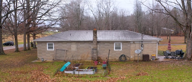 view of side of property featuring central air condition unit