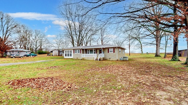 ranch-style home featuring a porch and a front lawn