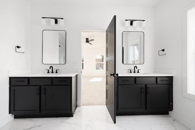 bathroom with ceiling fan and vanity