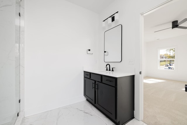 bathroom with ceiling fan and vanity