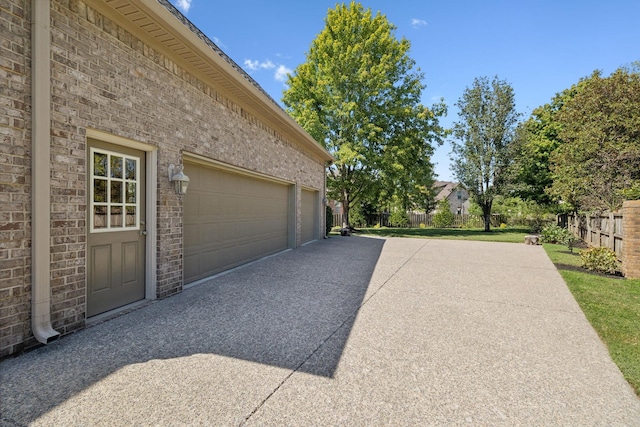 garage featuring a lawn