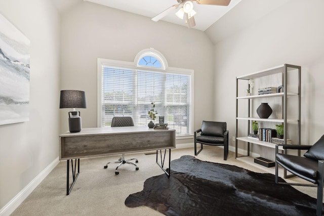 carpeted office space with lofted ceiling and ceiling fan