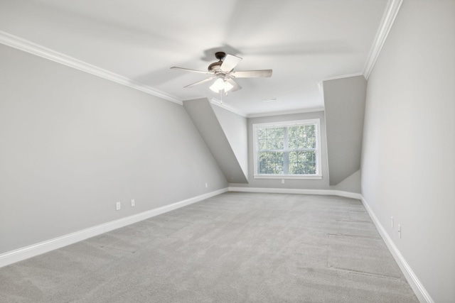 additional living space featuring ceiling fan and light carpet