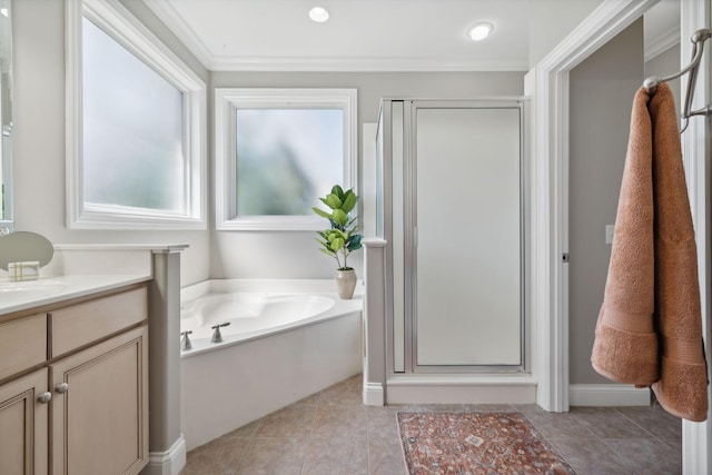 bathroom featuring independent shower and bath, tile patterned flooring, crown molding, and vanity