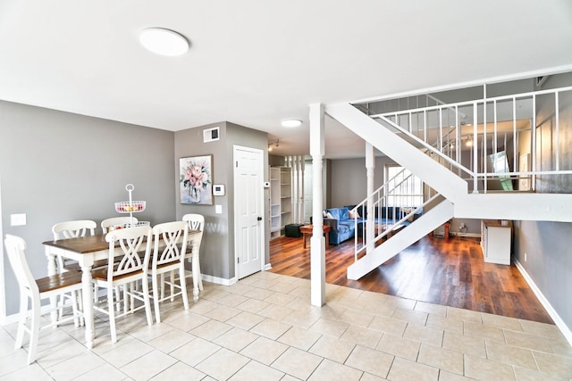 dining space featuring tile patterned flooring