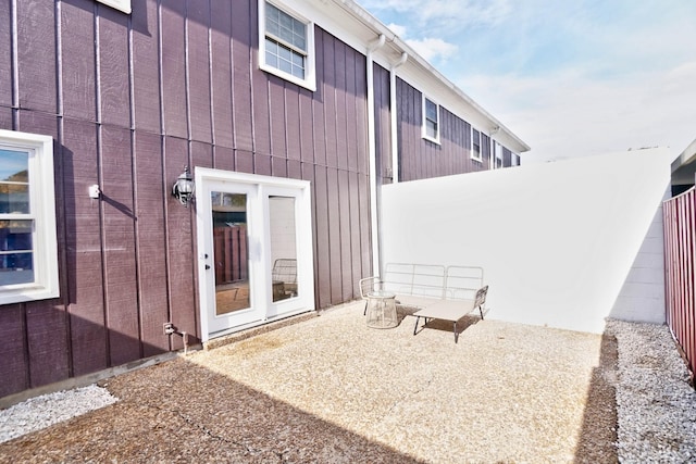 entrance to property featuring a patio area