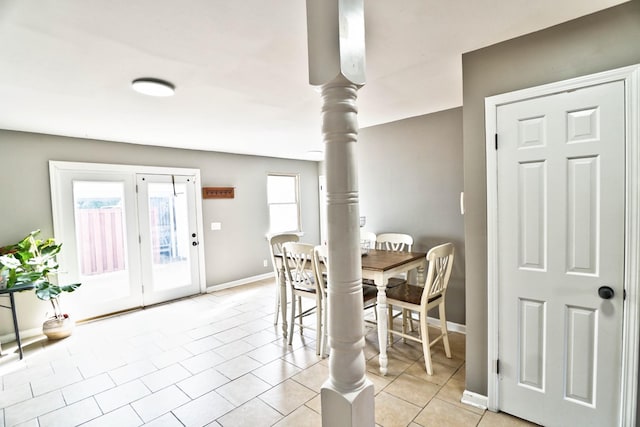 tiled dining space with decorative columns