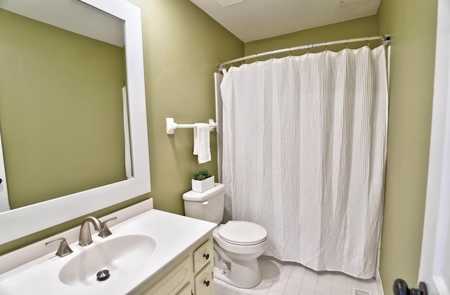 bathroom with vanity, toilet, and walk in shower