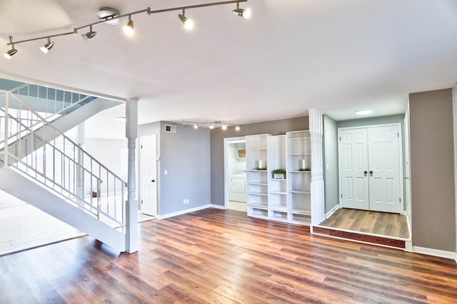 unfurnished living room featuring dark hardwood / wood-style flooring