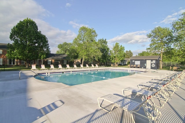 view of swimming pool with a patio area