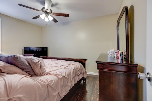 bedroom with ceiling fan and dark wood-type flooring