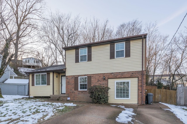 view of front of property with a storage shed