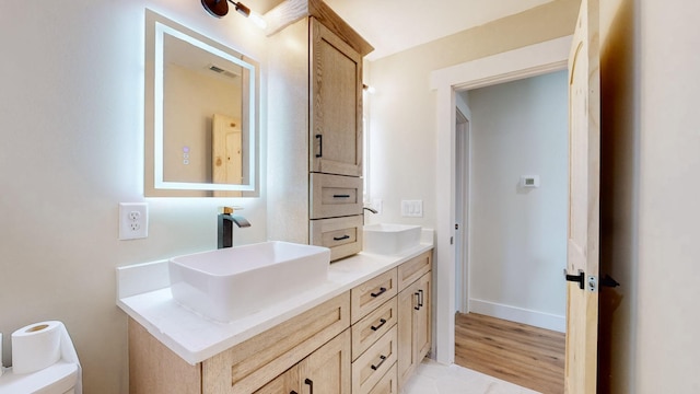 bathroom with toilet and vanity