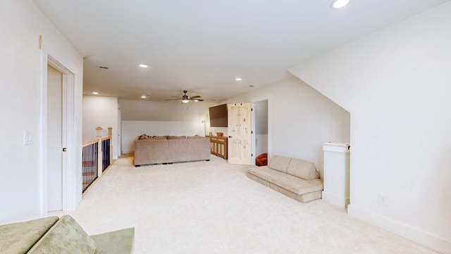 living room with lofted ceiling, light carpet, and ceiling fan