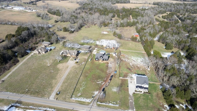 birds eye view of property with a rural view