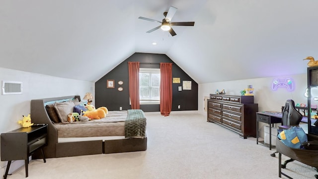 carpeted bedroom with ceiling fan and vaulted ceiling