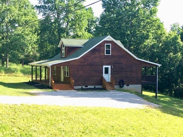 view of side of home with a lawn