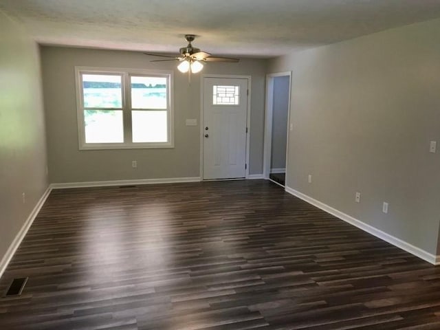 foyer with dark hardwood / wood-style flooring and ceiling fan