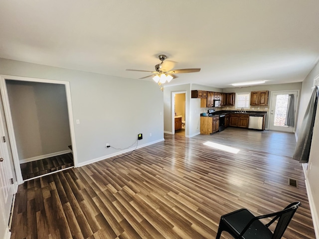 306 Turkey Creek Hwy, Carthage, TN 37030 - unfurnished living room with dark wood-type flooring, sink, and ceiling fan