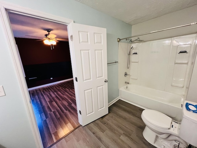 306 Turkey Creek Hwy, Carthage, TN 37030 - bathroom featuring hardwood / wood-style floors, shower / bathtub combination, ceiling fan, toilet, and a textured ceiling