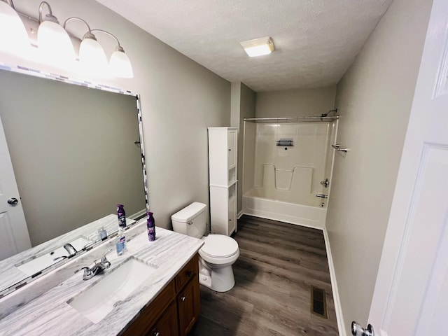 306 Turkey Creek Hwy, Carthage, TN 37030 - full bathroom with toilet, wood-type flooring, a textured ceiling, shower / bathtub combination, and vanity