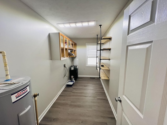 306 Turkey Creek Hwy, Carthage, TN 37030 - laundry area with water heater and dark wood-type flooring