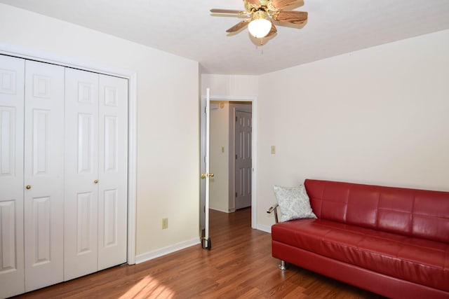 sitting room featuring ceiling fan and wood-type flooring