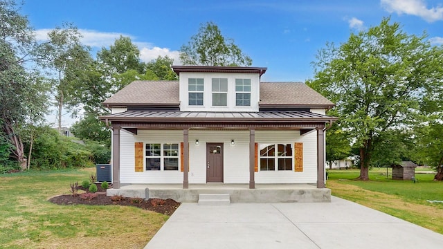 view of front of property with a porch, central AC, and a front yard