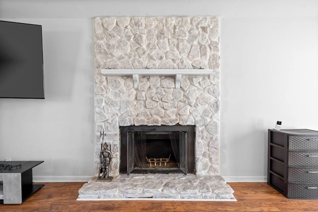 details with a fireplace and hardwood / wood-style floors