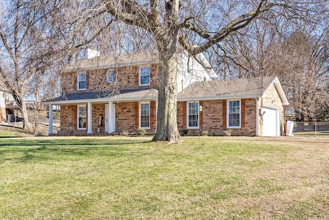 view of front of house featuring a front lawn and a garage