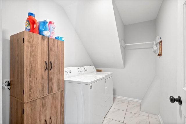 clothes washing area featuring washer and dryer