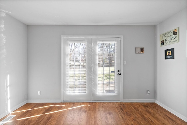 entryway with hardwood / wood-style flooring