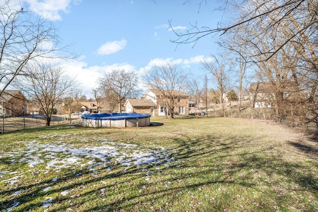 view of yard with a covered pool