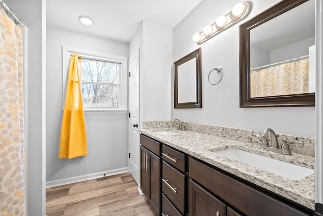 bathroom featuring vanity and hardwood / wood-style flooring