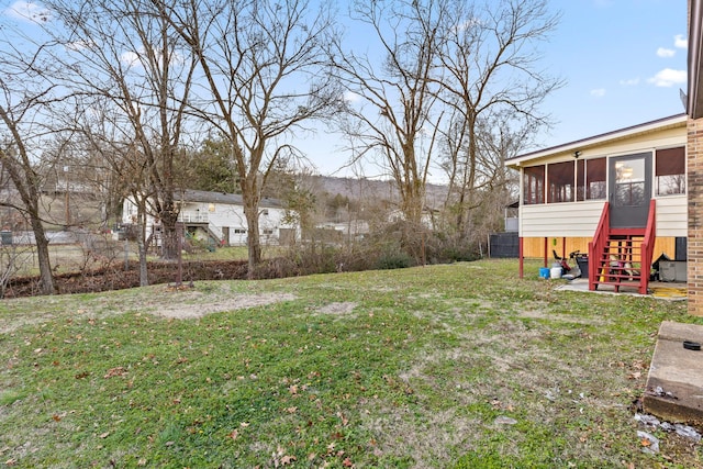 view of yard featuring a sunroom